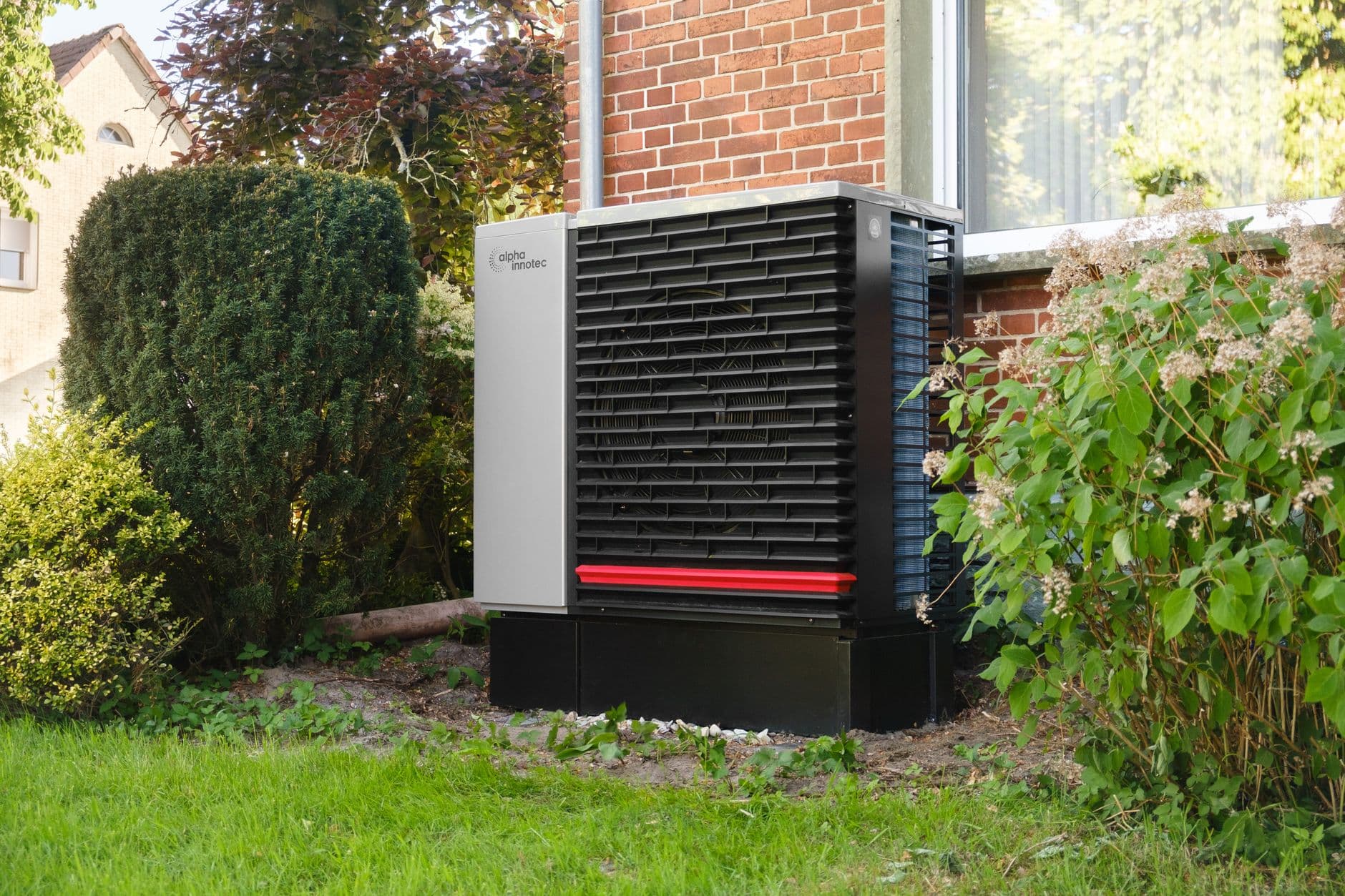Modern residential heat pump outdoor unit installed beside a contemporary home, representing the equipment category affected by the AIM Act GWP limits and A2L refrigerant transition under 40 CFR Part 84 Subpart C