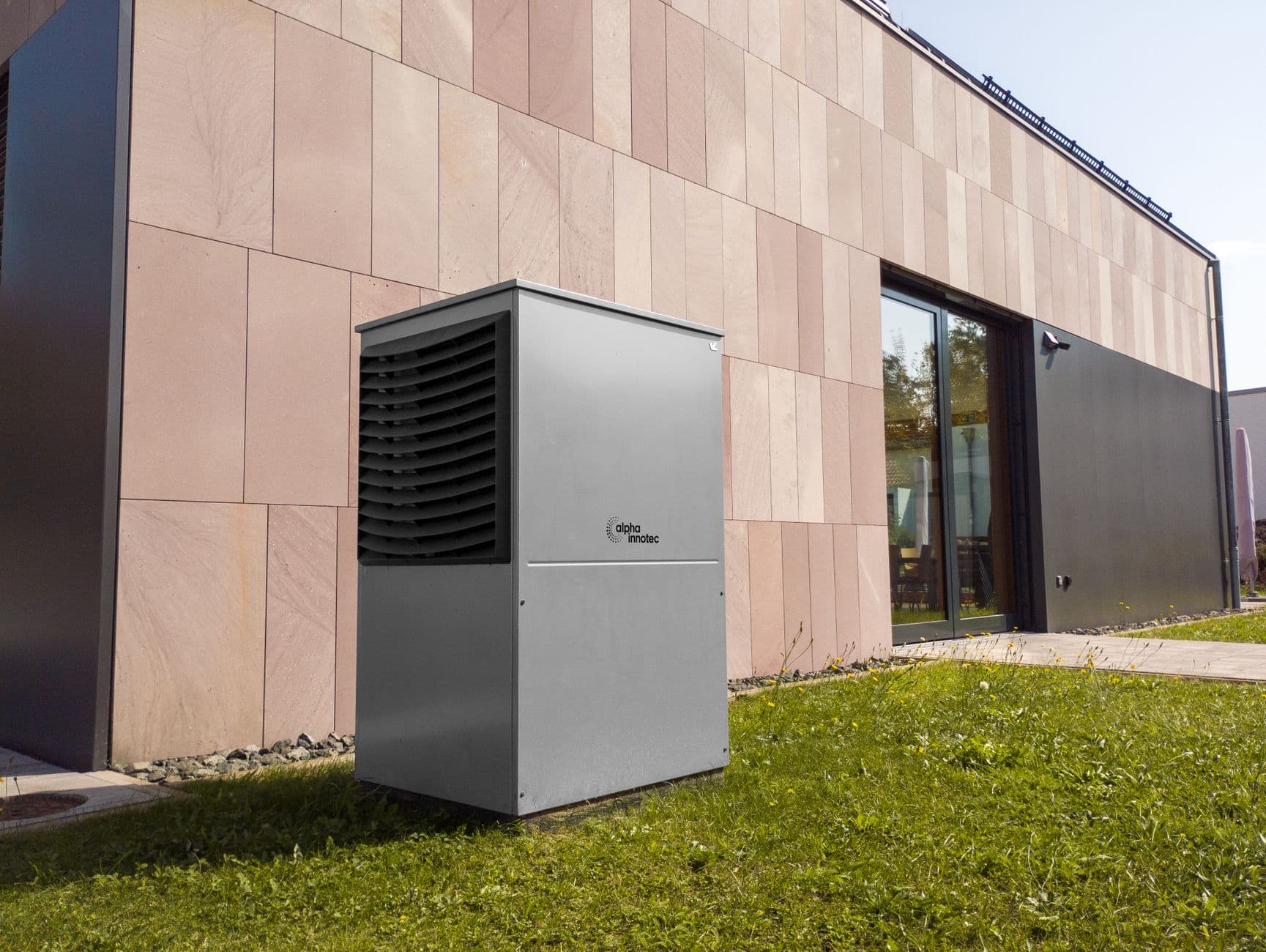 Modern heat pump outdoor unit installed next to a contemporary building, representing low-GWP A2L refrigerant equipment such as R-454B systems replacing R-410A under EPA 40 CFR Part 84 Subpart C